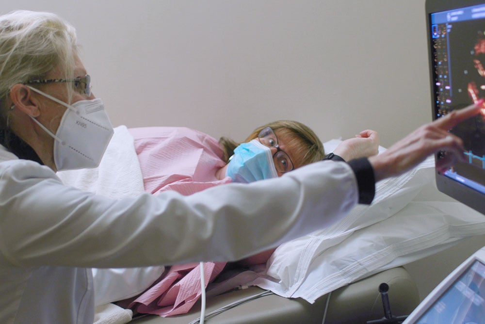 doctor-showing-scan-to-patient